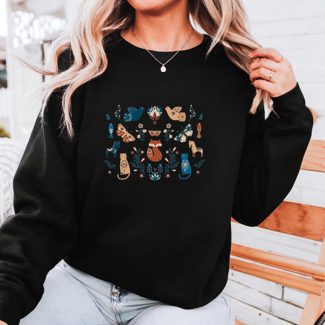 Cozy Black Sweatshirt with Whimsical Woodland Animal and Floral Design – Fox, Cat, and Bird Pattern